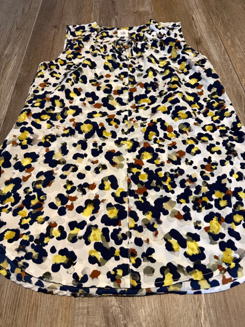 CAbi Fierce Seeing Spots sleeveless blouse featuring a colorful animal print - Picture 4 of 6